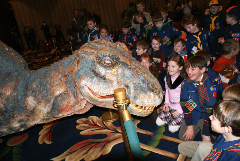 Scouts and company meet baby T-Rex on Monday at the Hotel Roanoke.