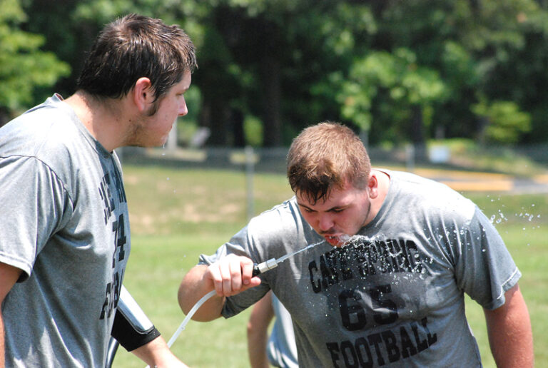 High School Football Practice Starts At The Water Cooler