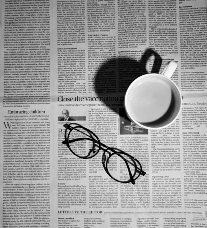 Newspaper with glasses